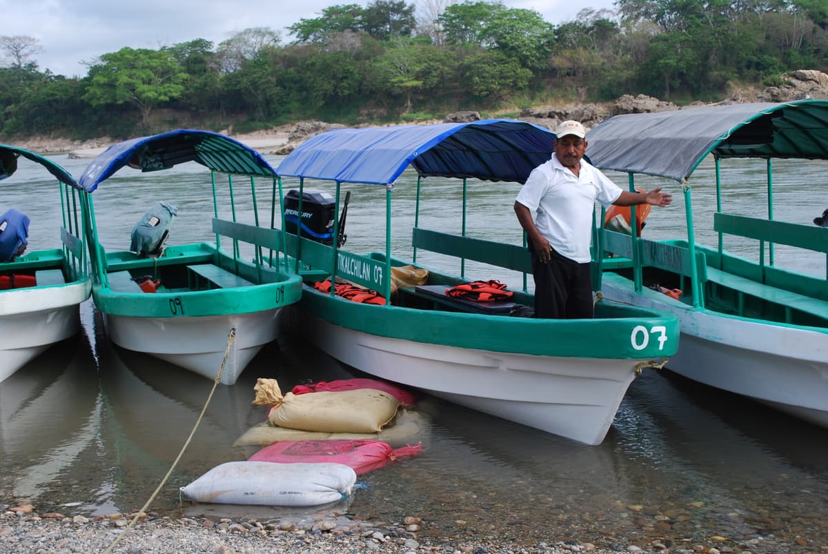 Covered lanchas moored at the Frontera Corozal jetty on the Usumacinta river