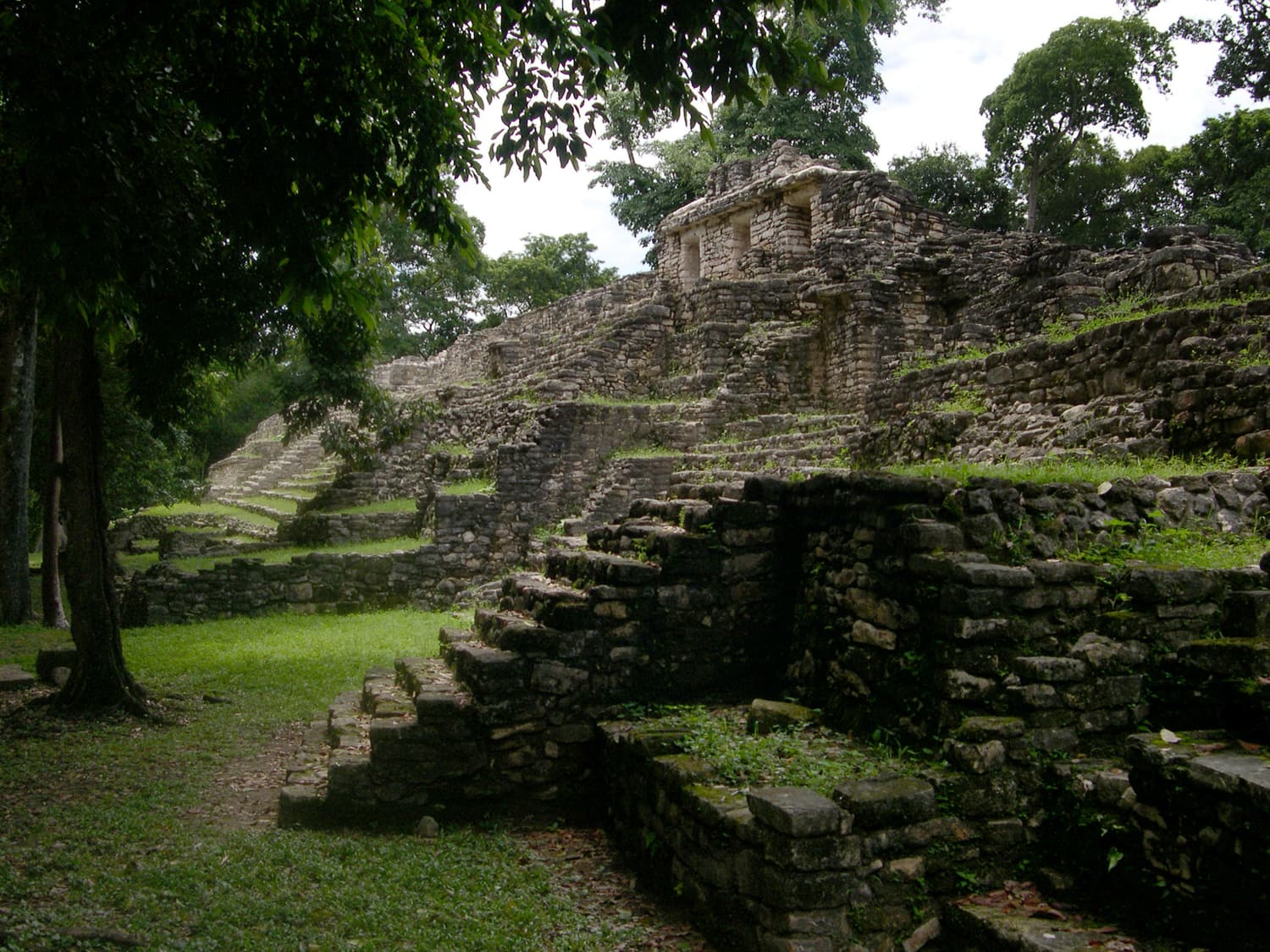 Stone stairways and terraces climbing the hill at Yaxchilán